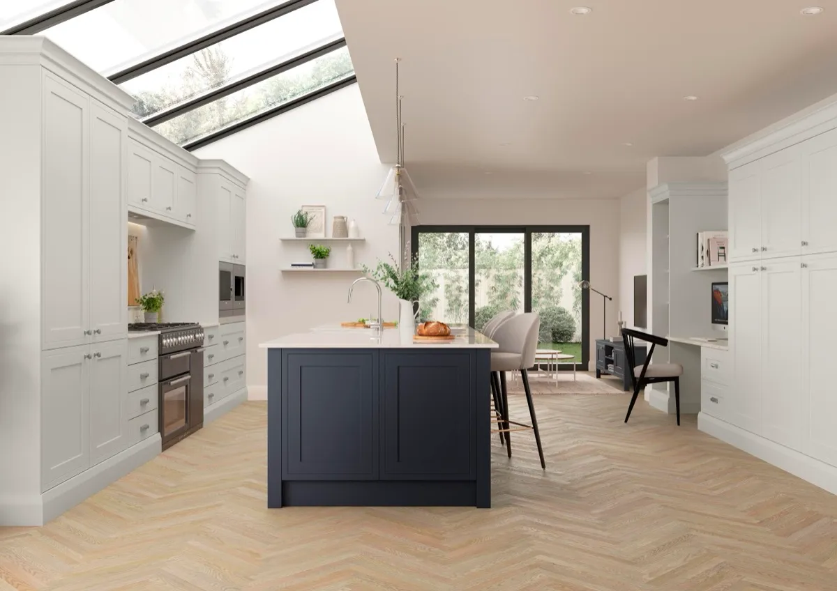 Light grey shaker kitchen with a navy island and herringbone floor
